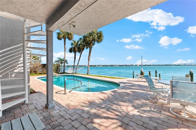 520 Belle Isle Ave, Belleair Beach, FL 33786 - outdoor pool featuring a patio and a water view
