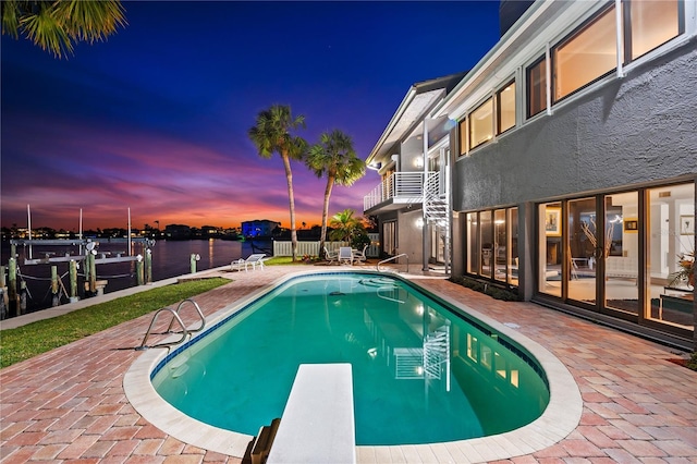 520 Belle Isle Ave, Belleair Beach, FL 33786 - view of pool with a patio, a fenced in pool, a boat dock, a diving board, and boat lift