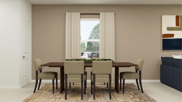 carpeted dining room featuring baseboards