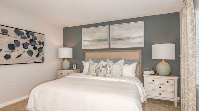 bedroom with carpet flooring and baseboards