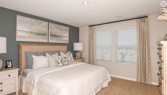 bedroom featuring carpet flooring and baseboards