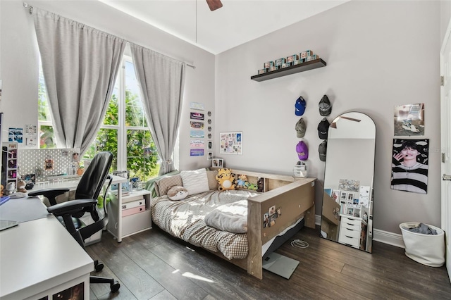 bedroom featuring hardwood / wood-style flooring, baseboards, and ceiling fan