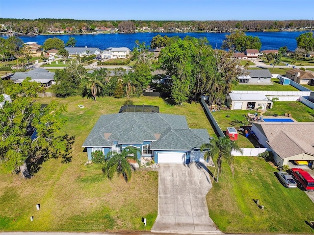 bird's eye view featuring a water view and a residential view