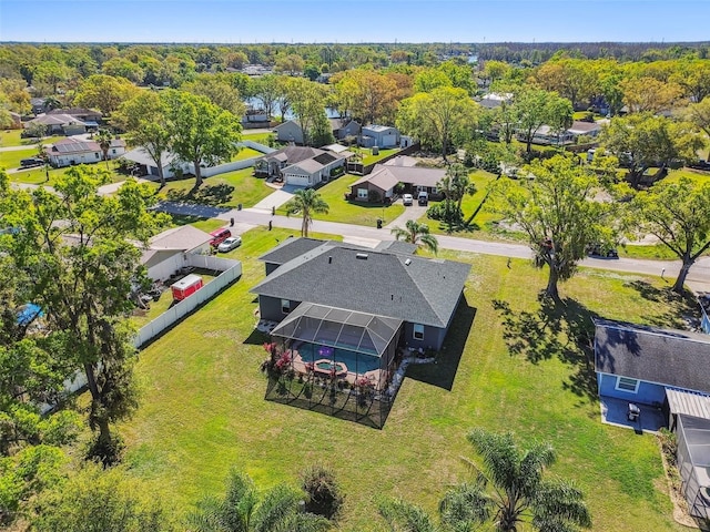 birds eye view of property with a residential view