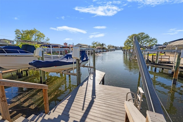 view of dock with a water view and boat lift