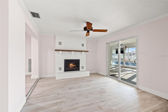 unfurnished living room with baseboards, light wood-style floors, a ceiling fan, and crown molding