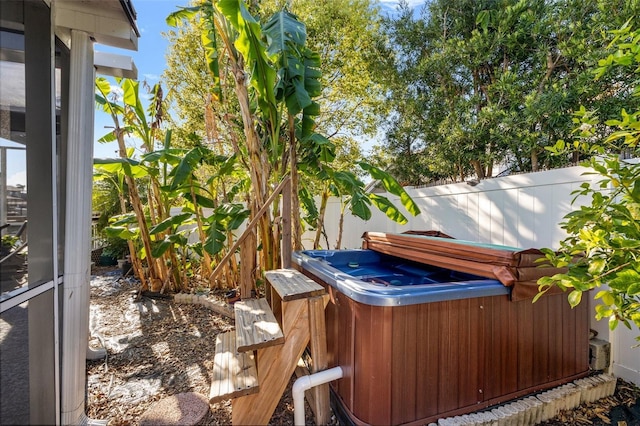 exterior space with a hot tub