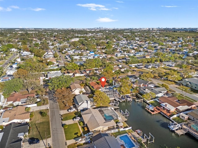 drone / aerial view with a residential view and a water view