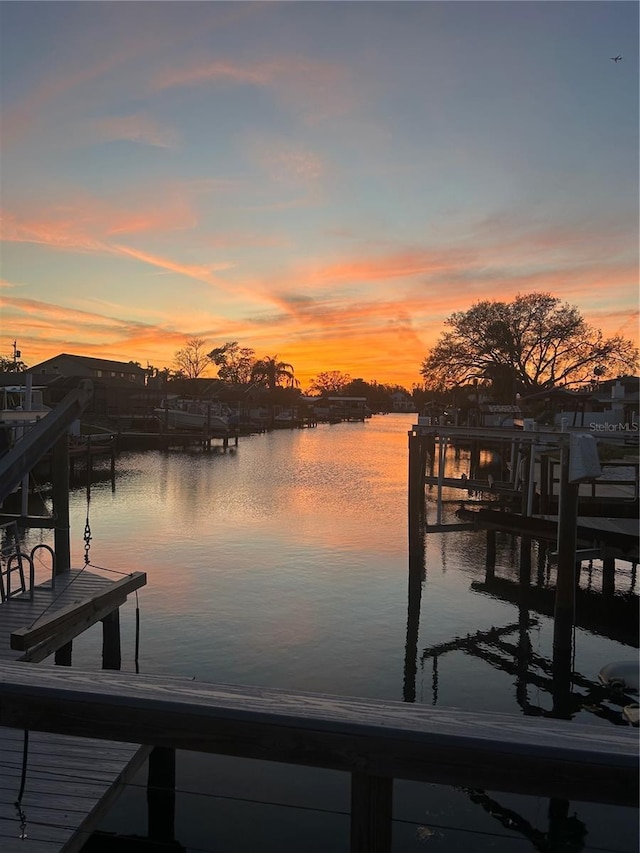 view of dock featuring a water view and boat lift