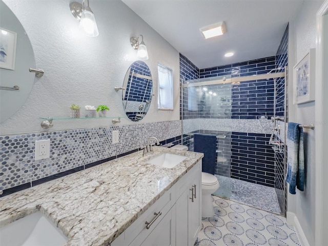 full bath featuring vanity, a stall shower, decorative backsplash, tile patterned floors, and toilet