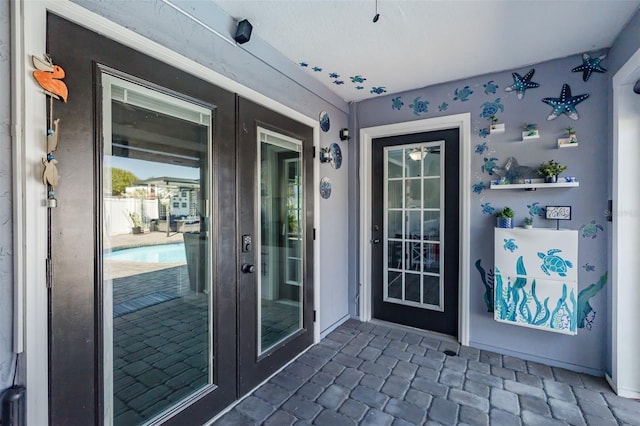 entrance to property featuring french doors