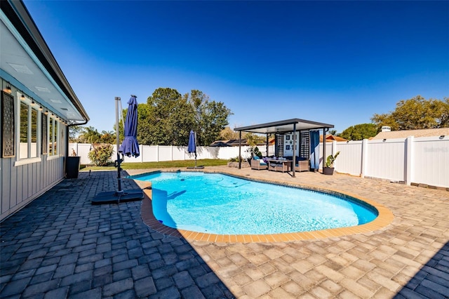 view of pool with a fenced in pool, a patio, and a fenced backyard