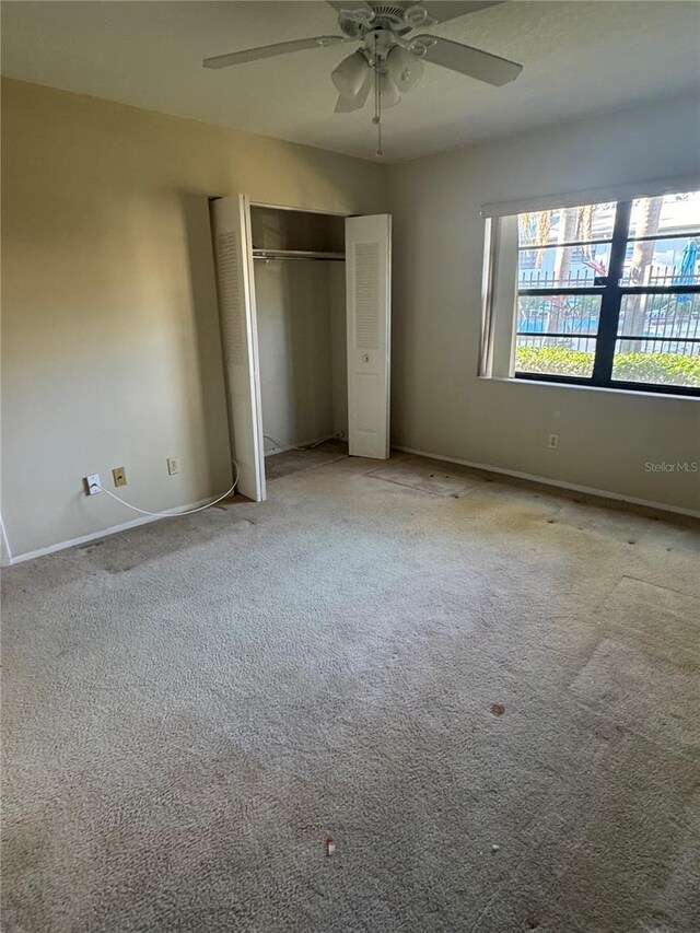 3046 Eastland Blvd Unit J106, Clearwater, FL 33761 - unfurnished bedroom with baseboards, carpet floors, a closet, and ceiling fan