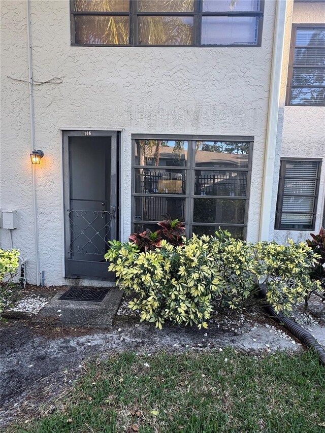 3046 Eastland Blvd Unit J106, Clearwater, FL 33761 - property entrance featuring stucco siding