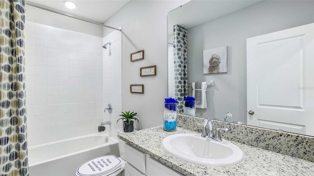 bathroom featuring toilet, vanity, and shower / bath combo with shower curtain