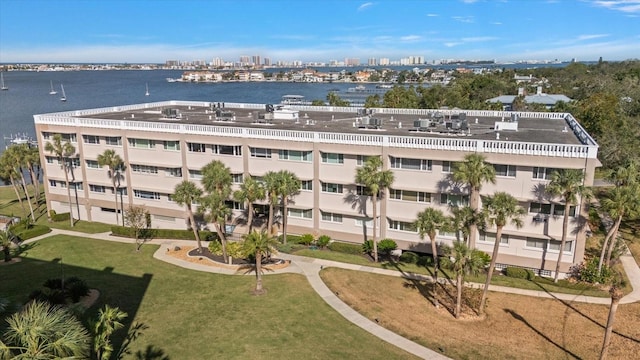 view of building exterior featuring a view of city and a water view