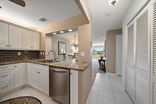 kitchen featuring a sink, visible vents, stainless steel dishwasher, and light tile patterned floors