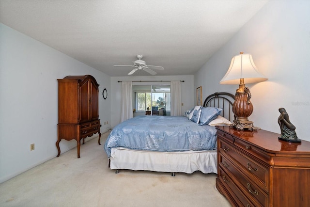 bedroom featuring ceiling fan, access to exterior, and light carpet