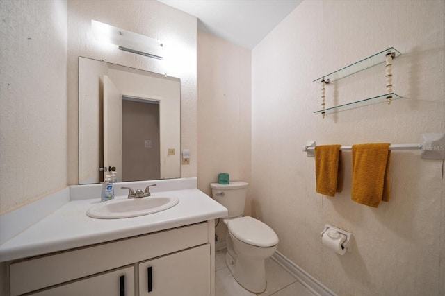 bathroom with vanity, tile patterned floors, and toilet