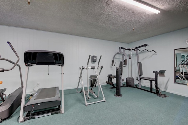 workout area with a textured ceiling