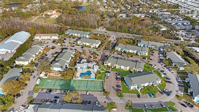 bird's eye view featuring a residential view and a water view