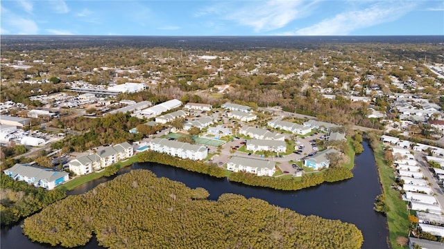 drone / aerial view featuring a residential view and a water view