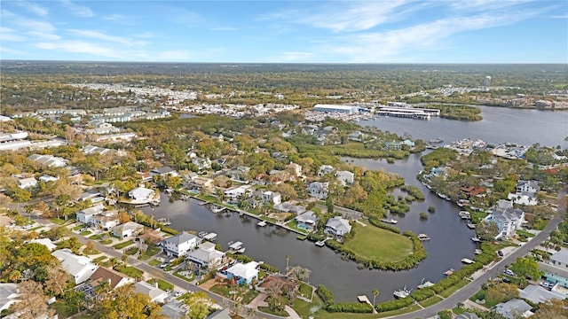 drone / aerial view featuring a residential view and a water view