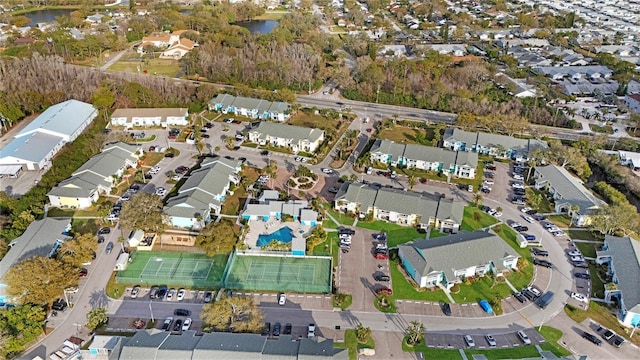 birds eye view of property featuring a water view and a residential view