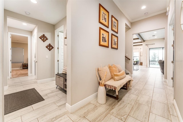 hallway with recessed lighting, baseboards, ornamental molding, and stairs