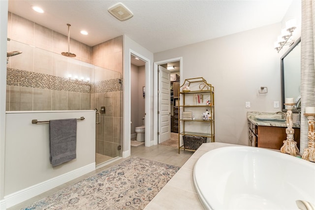 bathroom featuring visible vents, a shower stall, a textured ceiling, a garden tub, and toilet