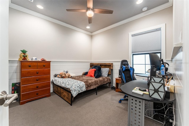 carpeted bedroom featuring a wainscoted wall, recessed lighting, crown molding, and a ceiling fan