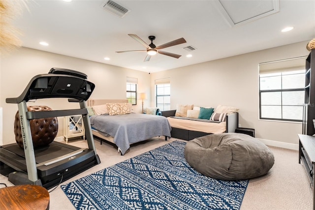 bedroom with light carpet, visible vents, recessed lighting, and baseboards