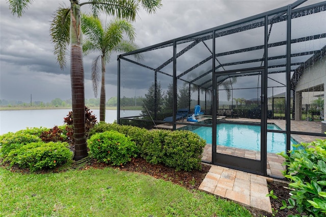 outdoor pool featuring a lanai and a water view