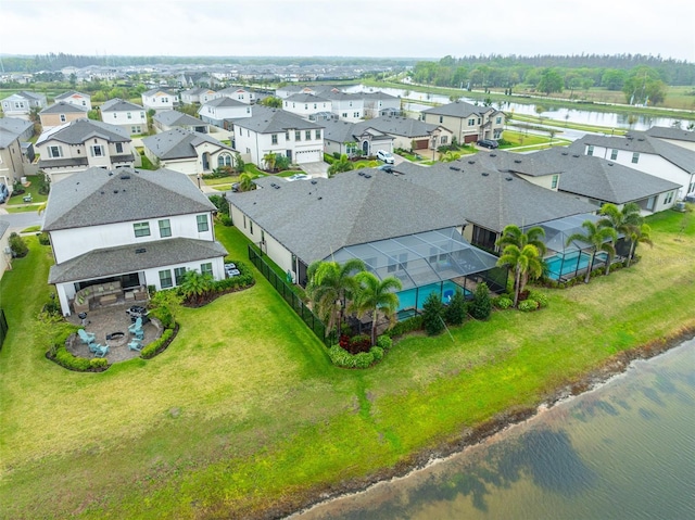 bird's eye view with a residential view and a water view