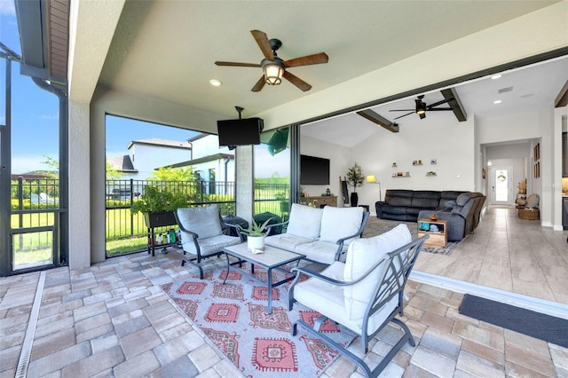 view of patio featuring an outdoor hangout area, a ceiling fan, and fence