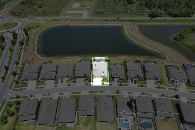 bird's eye view featuring a residential view and a water view