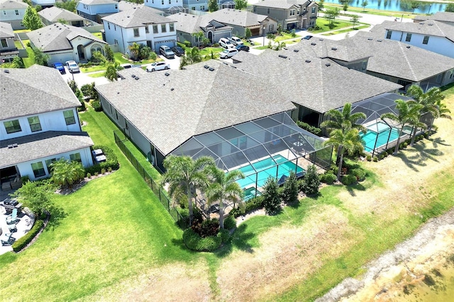 aerial view with a water view and a residential view