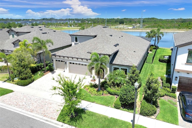 birds eye view of property with a water view
