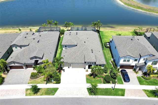 birds eye view of property with a water view