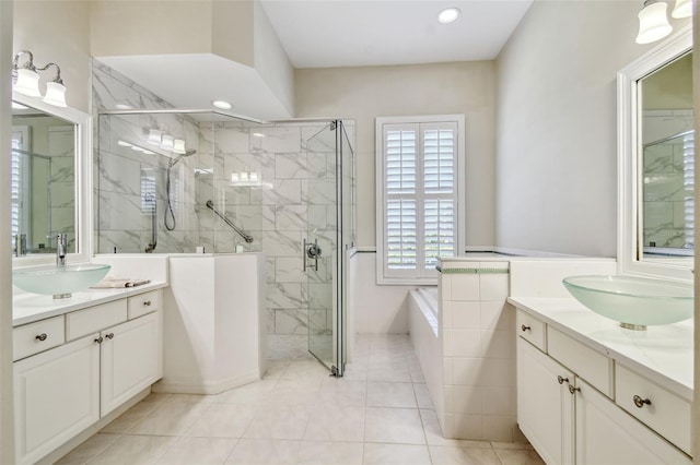 full bath featuring two vanities, a marble finish shower, and a sink