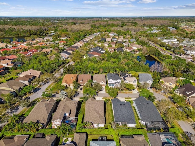 aerial view featuring a residential view and a water view