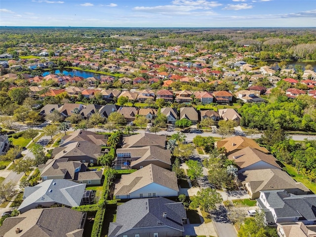 bird's eye view with a residential view and a water view