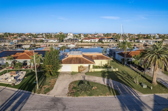 bird's eye view with a residential view and a water view