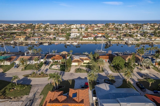 aerial view featuring a water view and a residential view