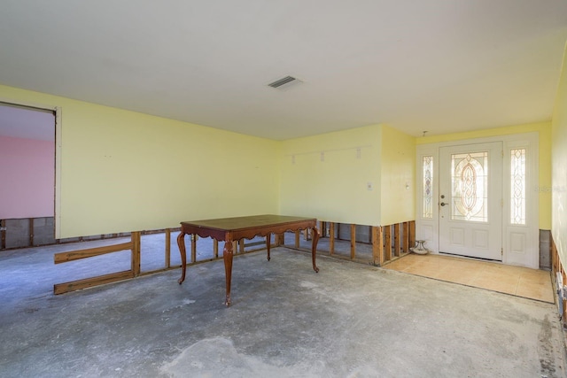 misc room with visible vents and concrete floors