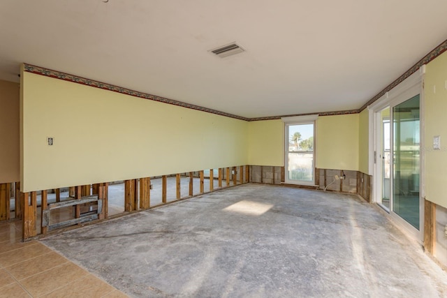 unfurnished room with crown molding and visible vents