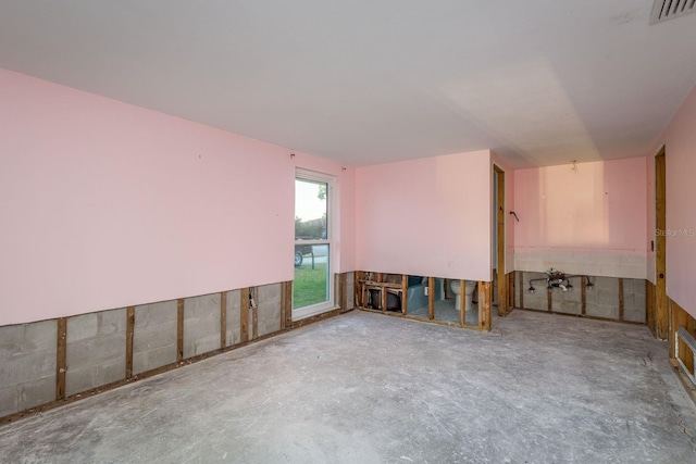 unfurnished room featuring visible vents and concrete flooring