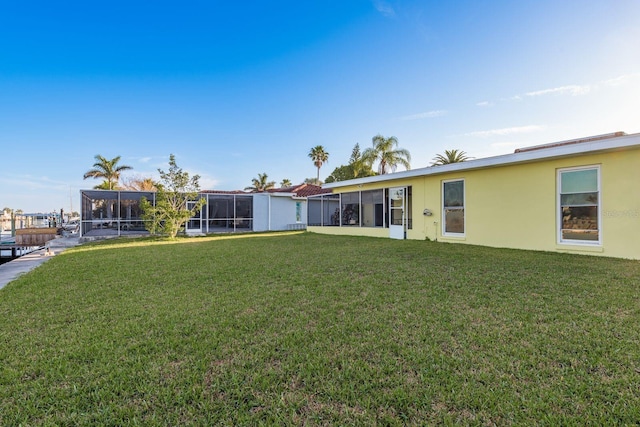 view of yard featuring a sunroom