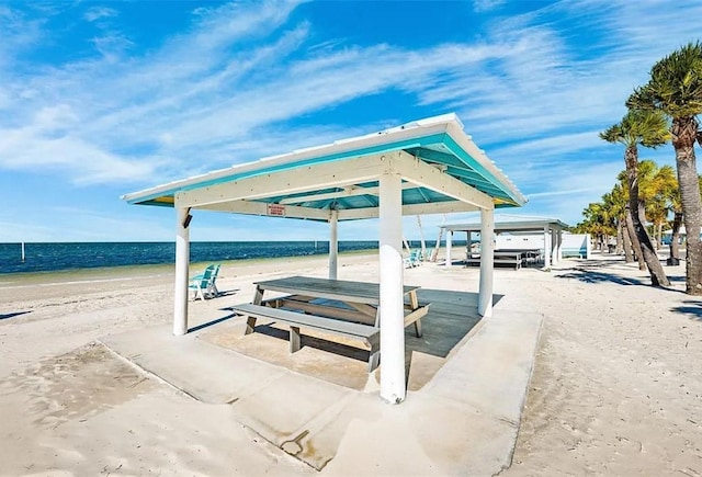 view of home's community featuring a view of the beach and a water view