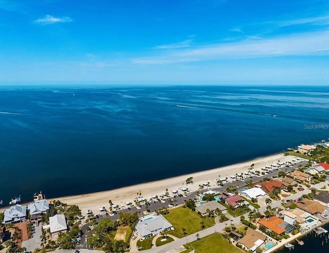 bird's eye view with a residential view, a water view, and a beach view